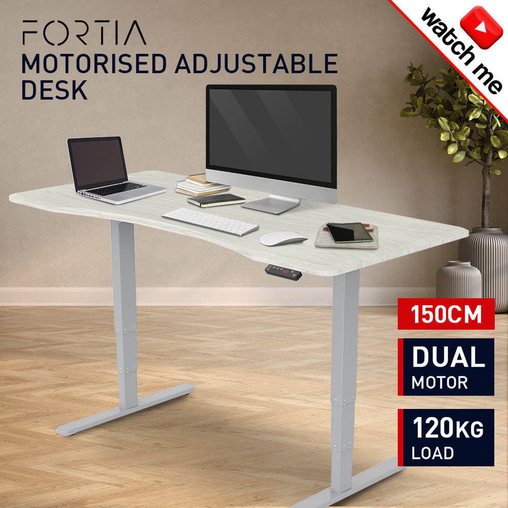 Fortia Sit To Stand Up Standing Desk, 150x70cm, 62-128cm Electric Height Adjustable, Dual Motor, 120kg Load, Arched, White Oak Style/Silver Frame