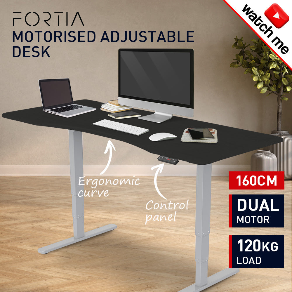 Fortia Sit To Stand Up Standing Desk, 160x75cm, 62-128cm Electric Height Adjustable, Dual Motor, 120kg Load, Arched, Black/Silver Frame