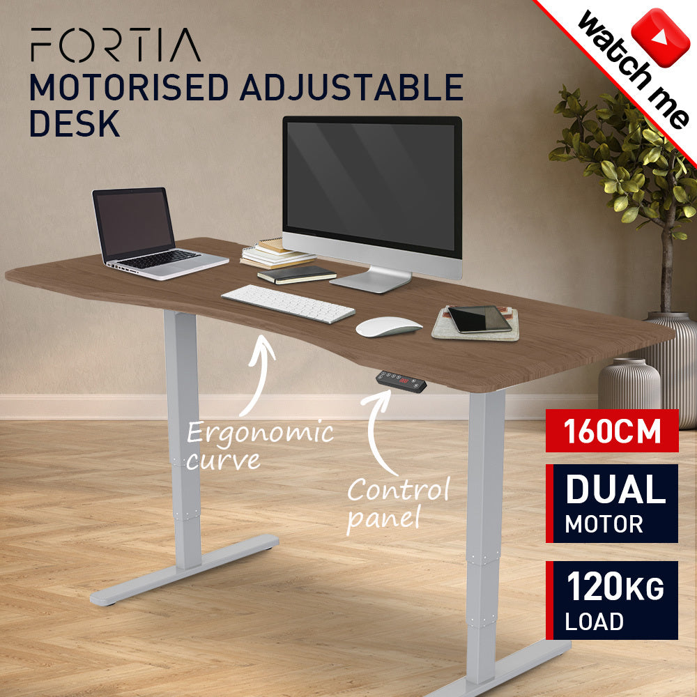 Fortia Sit To Stand Up Standing Desk, 160x75cm, 62-128cm Electric Height Adjustable, Dual Motor, 120kg Load, Arched, Walnut Style/Silver Frame