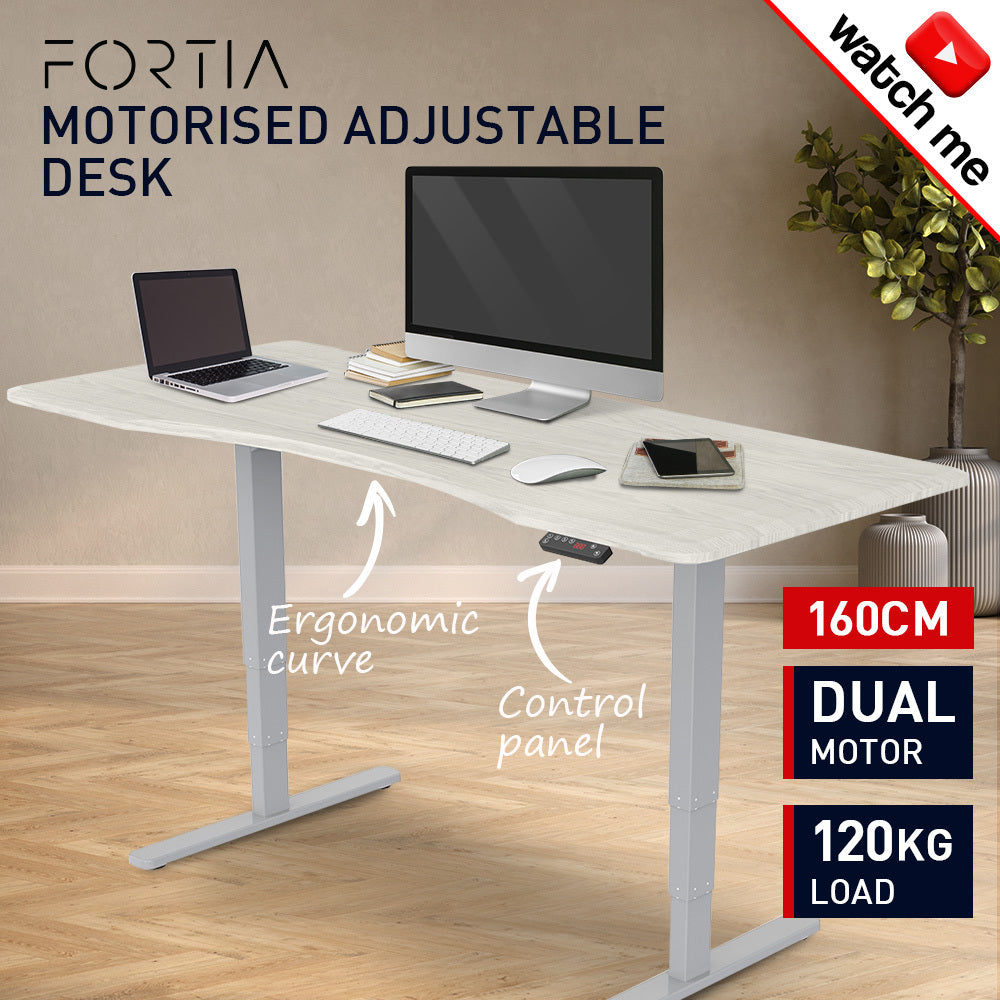 Fortia Sit To Stand Up Standing Desk, 160x75cm, 62-128cm Electric Height Adjustable, Dual Motor, 120kg Load, Arched, White Oak Style/Silver Frame