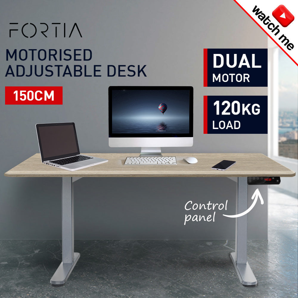 Fortia Sit To Stand Up Standing Desk, 150x70cm, 62-128cm Electric Height Adjustable, Dual Motor, 120kg Load, White Oak Style/Silver Frame